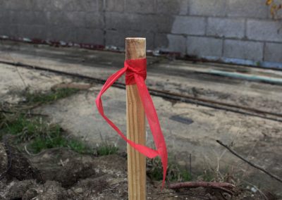 Red Biodegradable Roll Flag Tied to a Stick